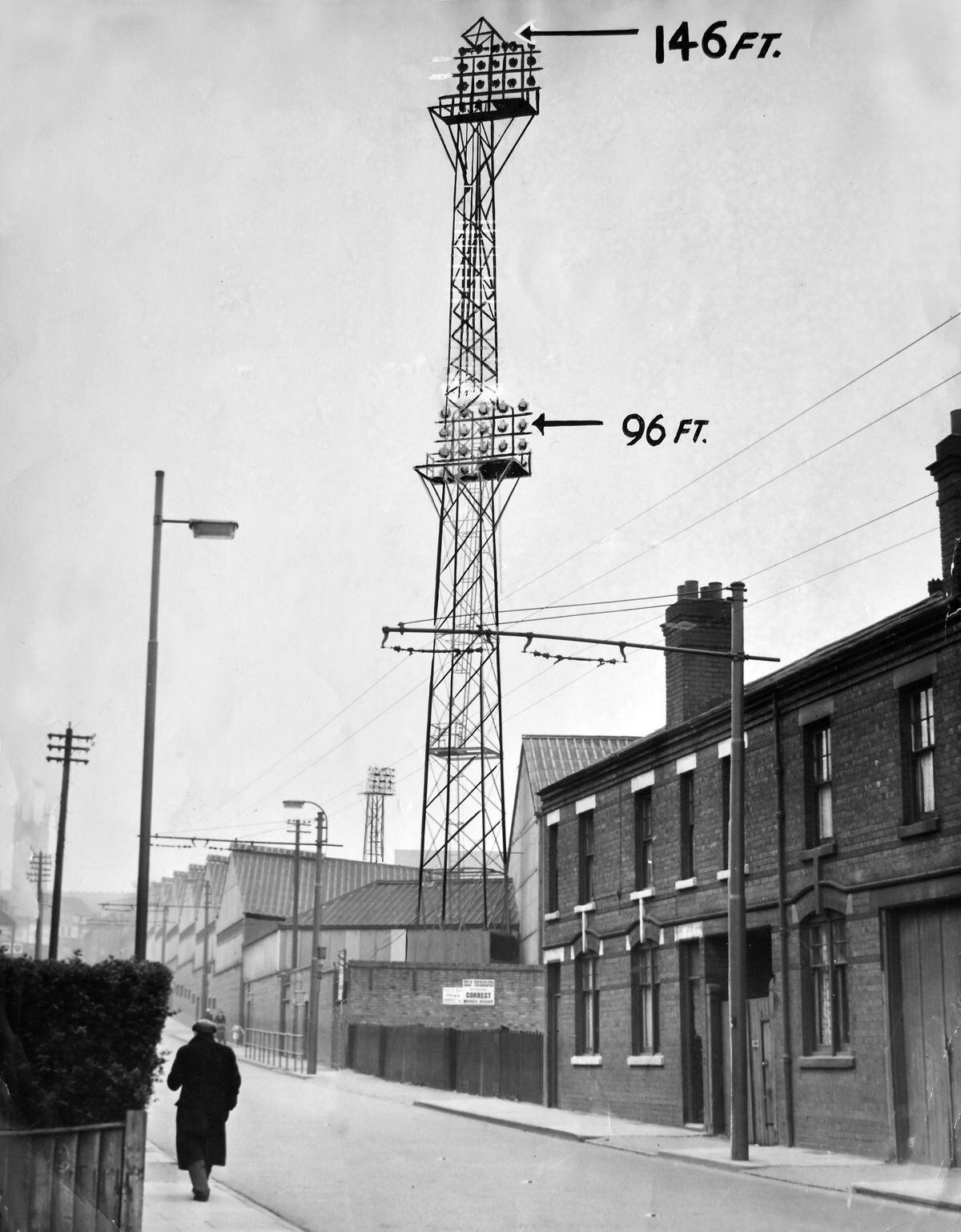 A view from Park Road in April 1957 showing two of the Molineux floodlight pylons, to which the newspaper artist has demonstrated how they would be extended to 146ft in a big upgrade.