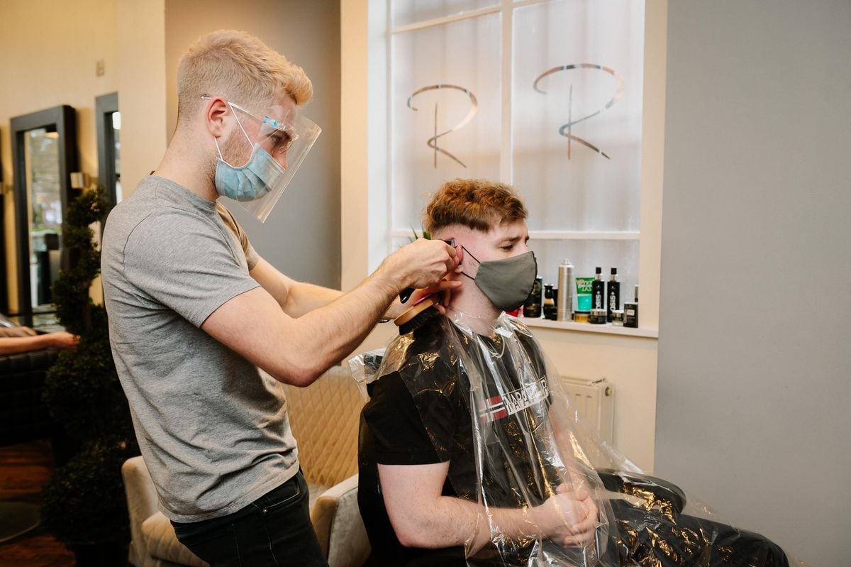 Rizzo Hairdressing in Wellington, Telford. Picturec: Barber Louis Davies and customer Daniel McInnes from Telford