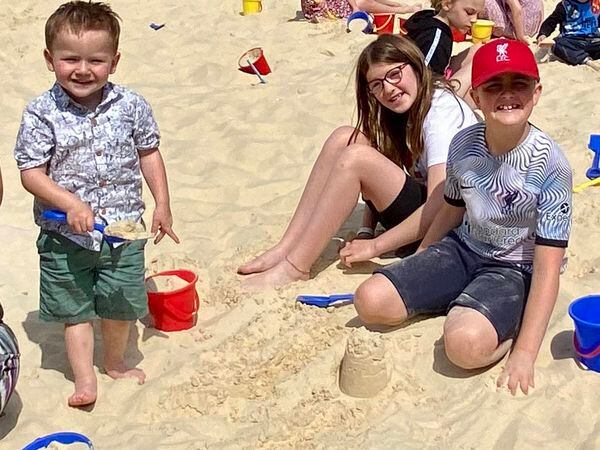 Ryan Earl, right with his cousins, Lily and Jacob Earl enjoying life on the beach
