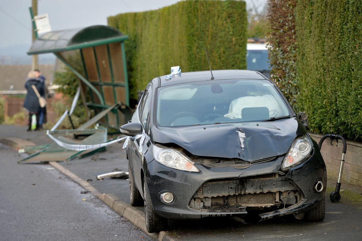 The car driver lost control and crashed into the bus stop where a mother and child were waiting