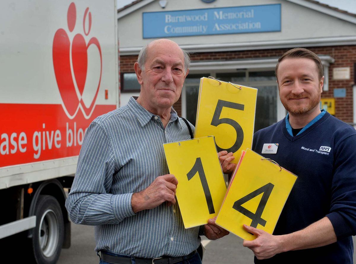 Eddie Mason, from Lichfield, giving his 154th donation of blood at Burntwood Memorial Community Hall, pictured with Steve Barnes who was there to help with people donating