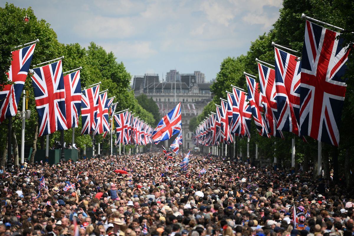 Members of the public fill the Mall before a flypast during the Trooping the Colour