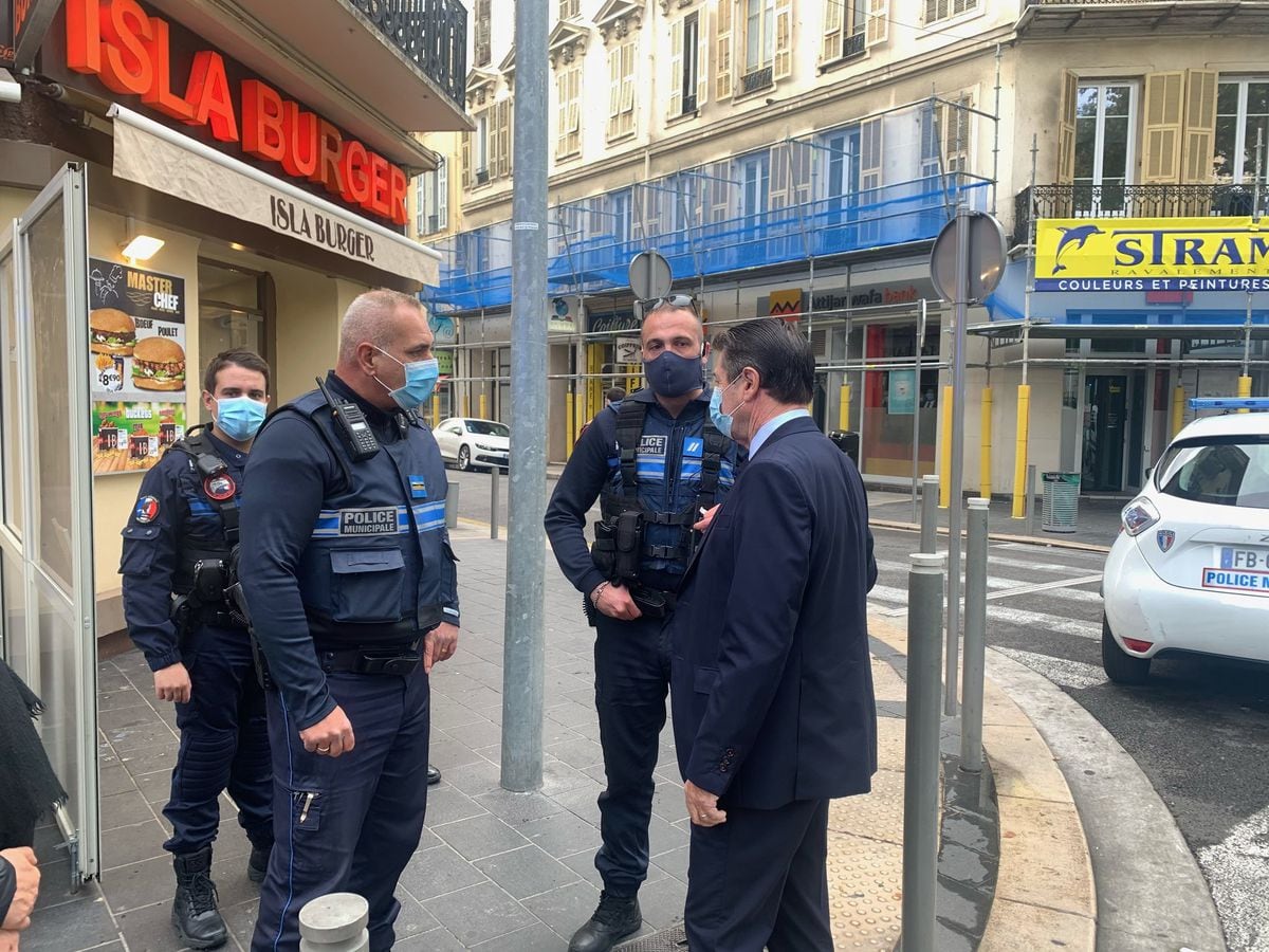 The Mayor of Nice Christian Estrosi with police at the scene where the knife attack took place in Nice