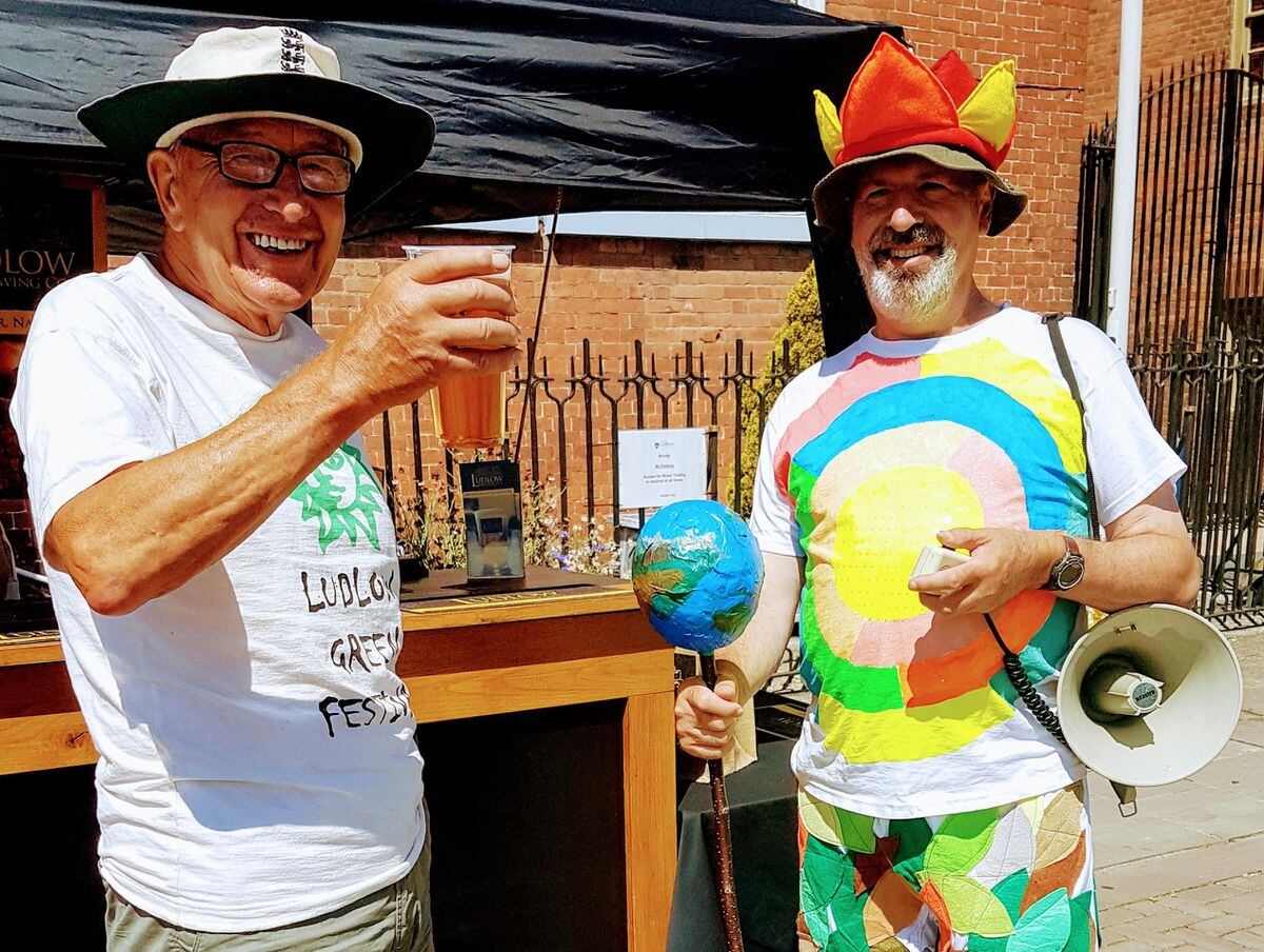 Volunteer Roger Furniss, left, and Green Festival mascot Mike Beazle at a previous festival