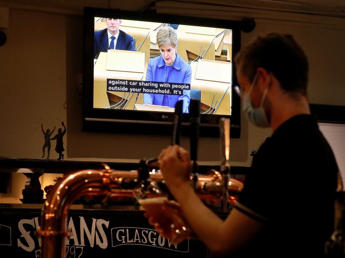 Nicola Sturgeon on TV in a bar