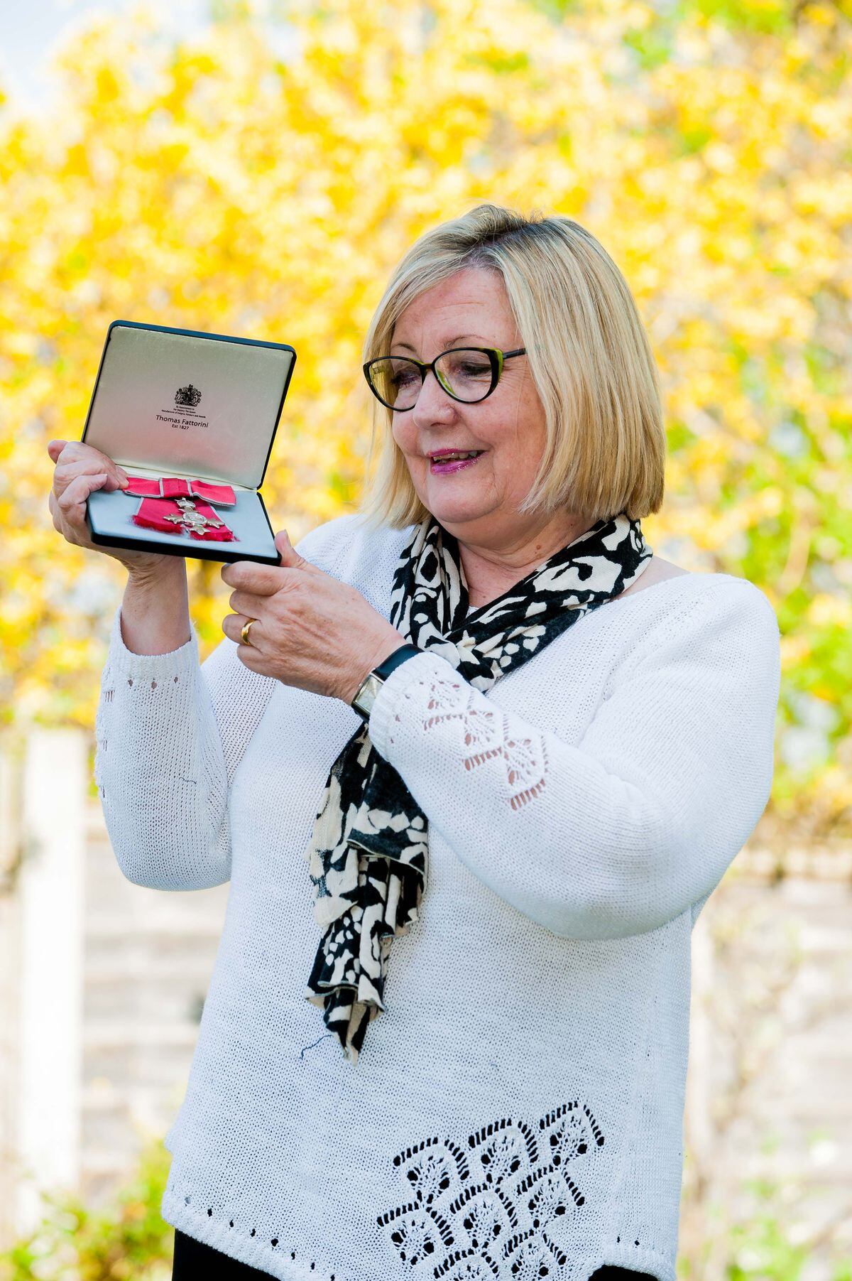 Carol Scott with her MBE medal  