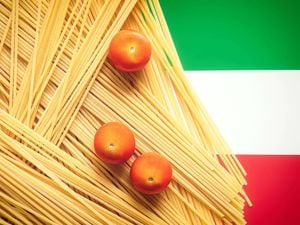 Raw pasta on top of the Italian flag