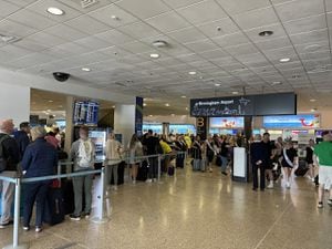 People queueing for Tui desk at Birmingham Airport