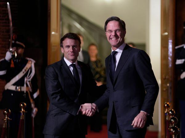 French President Emmanuel Macron, left, and Dutch Prime Minister Mark Rutte meet in The Hague, Netherlands
