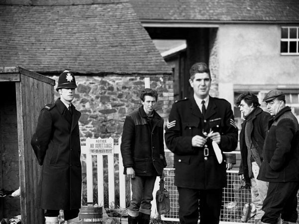 November 1967: Police keep guard at the entrance to Galn-yr-Afon farm, near Oswestry, during a weekend that saw several outbreaks of foot and mouth disease