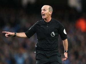 Mike Dean doing his day job (PA)