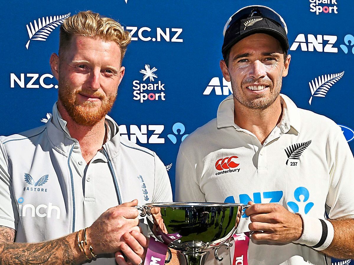 England’s captain Ben Stokes and New Zealand counterpart Tim Southee share the trophy after the drawn series