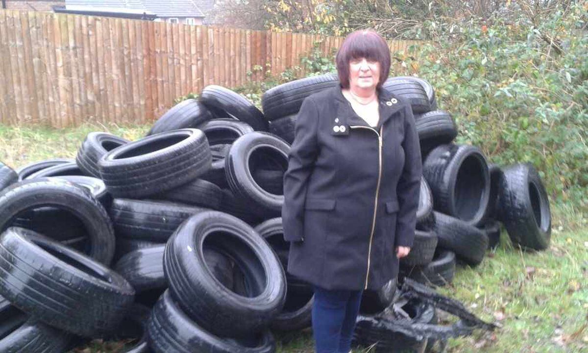 Jean Pugh with the tyres near her home