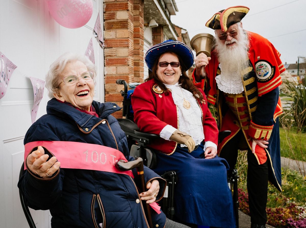 Lina Cori was surprised for her 100th birthday by family, neighbourd and Shrewsbury town crier Martin Wood and his wife Sue