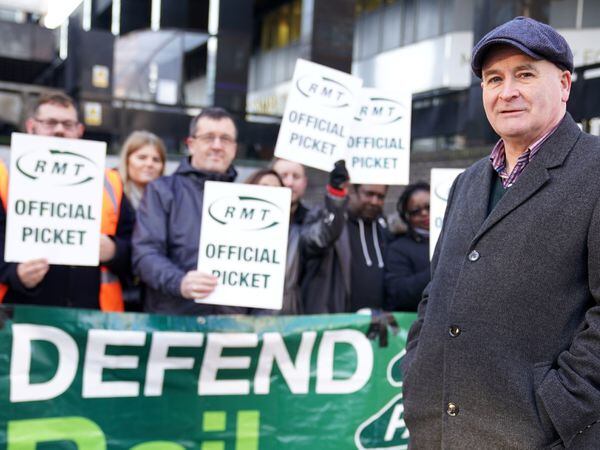 Mick Lynch, general secretary of the Rail, Maritime and Transport union, joins union members on the picket line