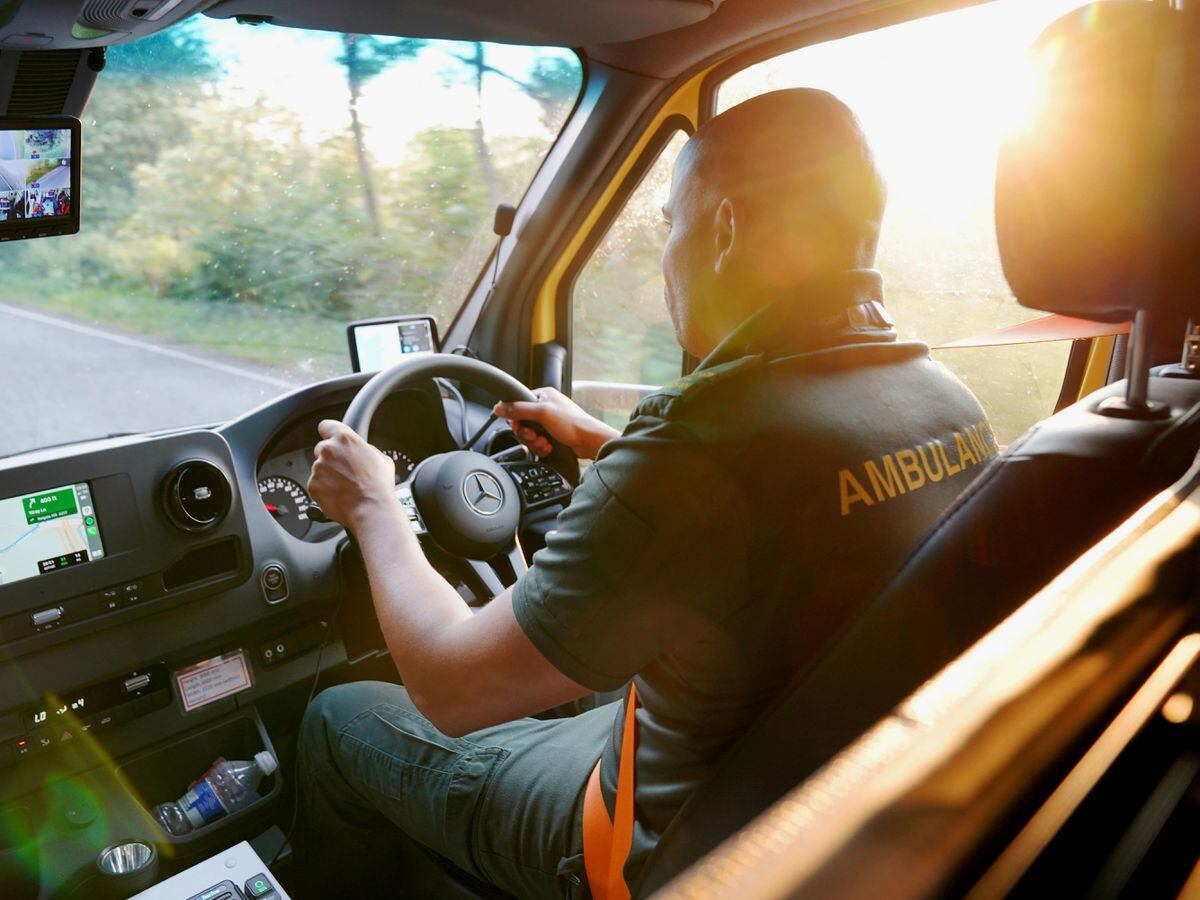 Ambulance technician drives vehicle