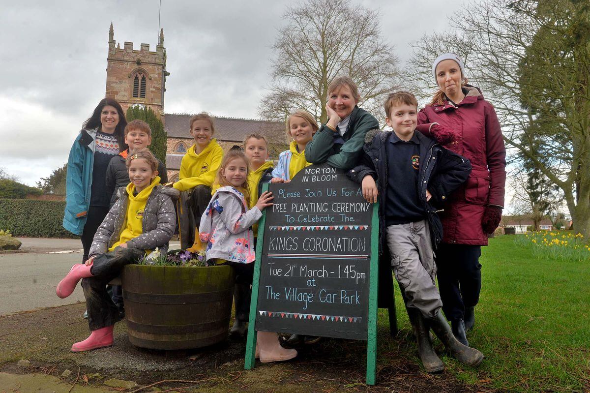 Pupils from Norton in Hales School and community members including those from Norton in Hales in Bloom, who were planting trees to commemorate the coronation of King Charles III.