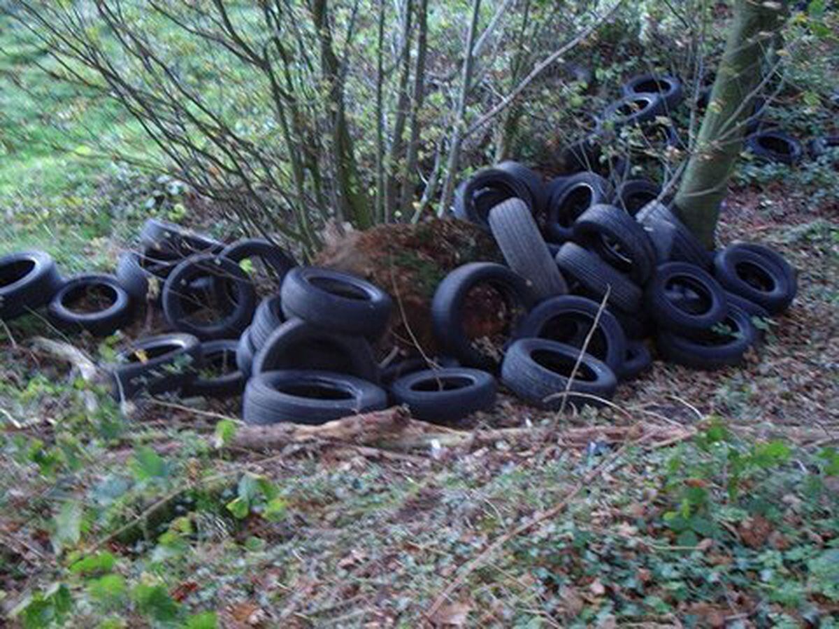A file picture of tyres dumped in Shropshire beauty spot Ruckley Woods 