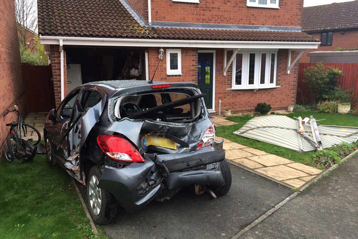 Van hits car and garage in Shrewsbury as driver has seizure