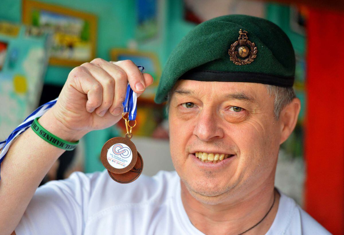 Former Royal Marine Nick Redshaw, from Wellington, holding his Veterans Games medals