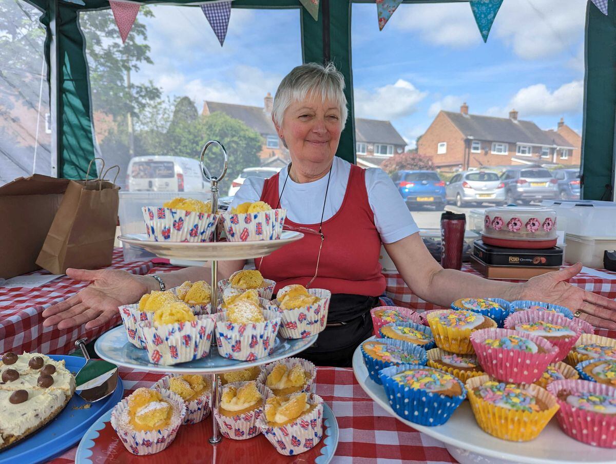 Monica Fawcett helps sell the cakes at Tibberton's coronation celebration