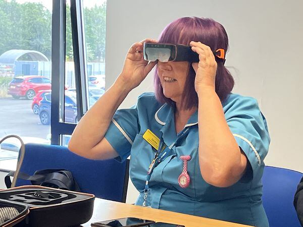 Nurse wears NHS goggles
