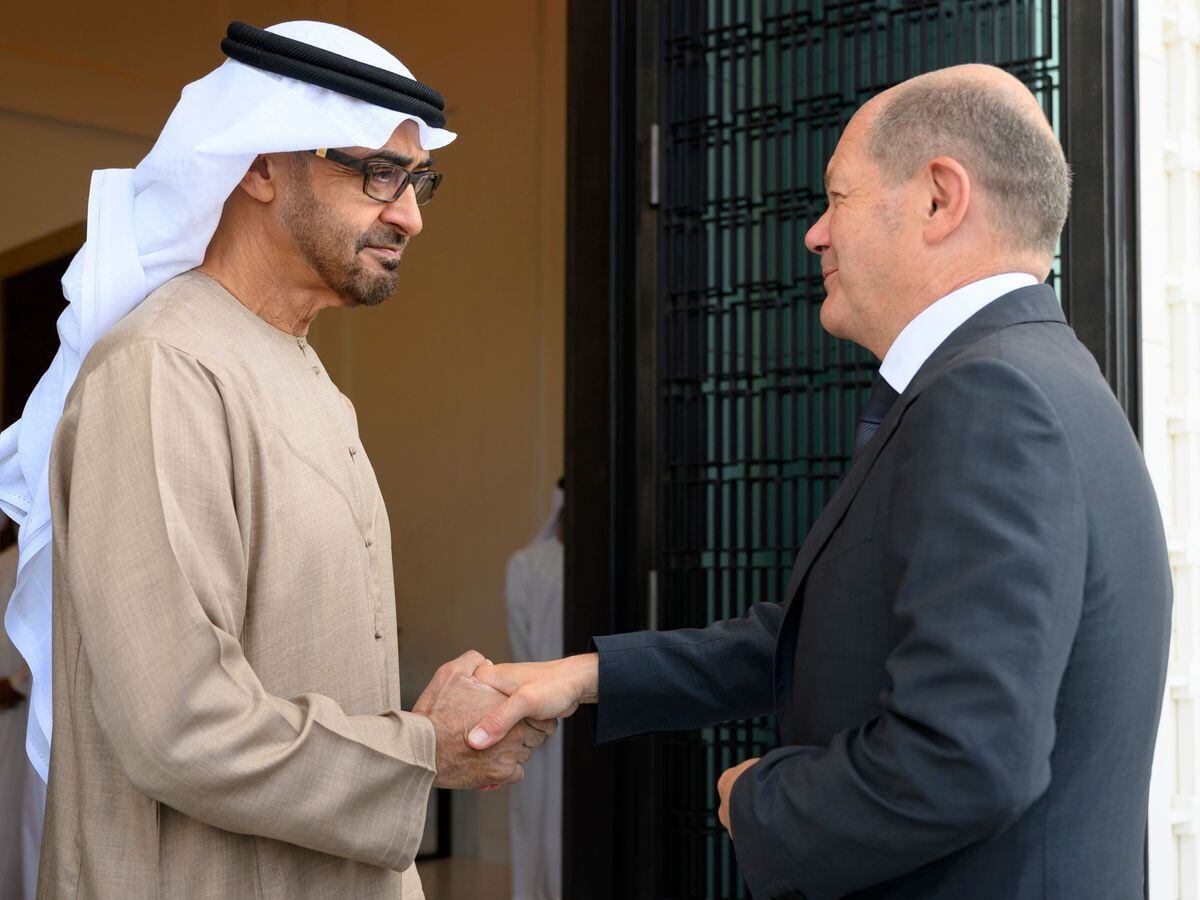 Sheikh Mohamed bin Zayed Al Nahyan, President of the UAE left, shakes hands with German Chancellor Olaf Scholz, at Al Shati Palace in Abu Dhabi on Sunday September 25 2022