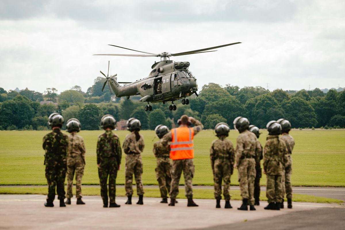 Air Cadets watch over an RAF Puma Helicopter