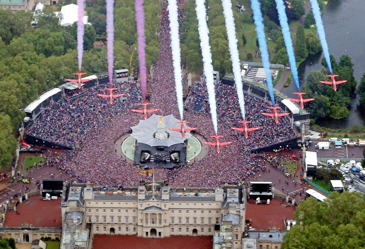 The Red Arrows flying in formation over Buckingham Palace