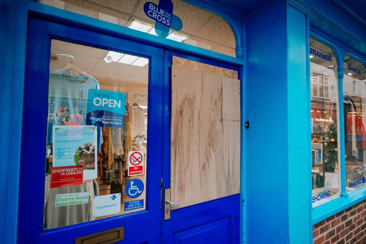 Blue Cross and Cancer Research UK had to board up their doors after glass panels were smashed.