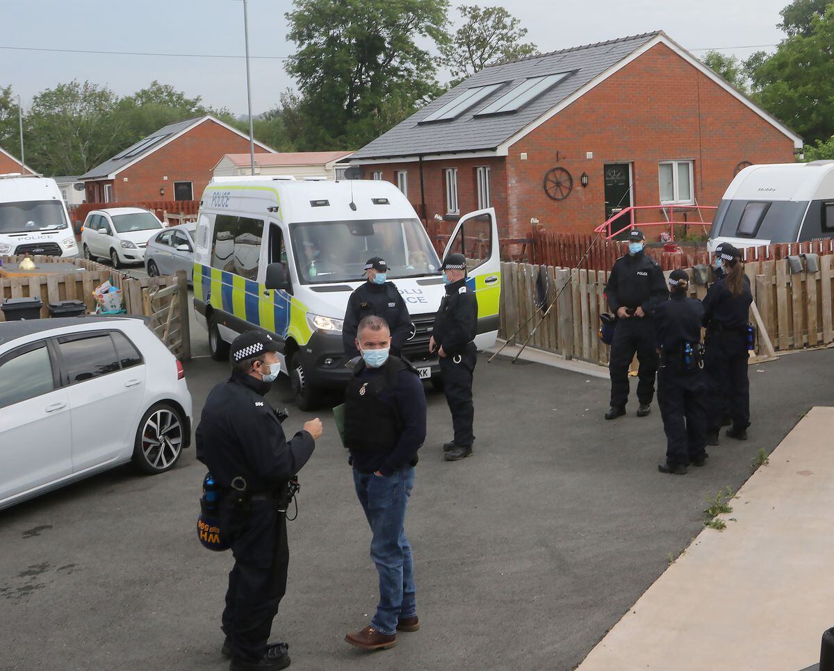 Over 30 police vehicles at Leighton Arches caravan site in Welshpool during the raid in June last year. Photo: Phil Blagg Photography
