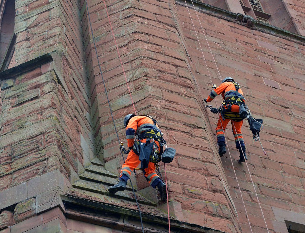Workmen using abseil ropes to repair St Leonard's in Bridgnorth on Tuesday (Picture by Eddie Brown)