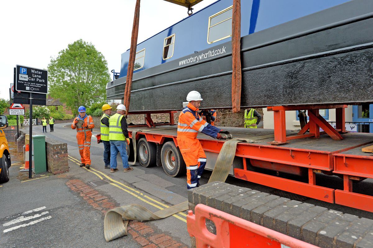 The boat being lifted into place on Newport's canal