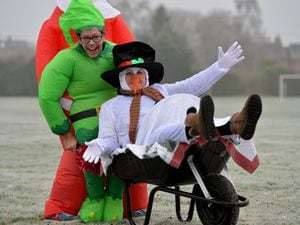 Sue Holliday and Jon Edge are pictured at freezing cold Wem, warming up for the town's charity wheelbarrow race on Sunday