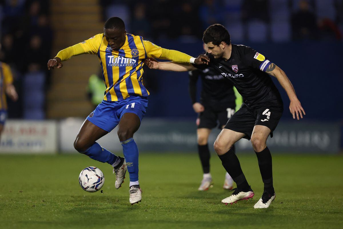 Daniel Udoh of Shrewsbury Town and Anthony O'Connor of Morecambe (AMA)