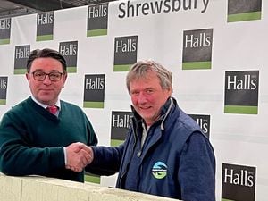 Andrew Bebb (right) thanks Halls director James Evans for the company’s pledge to match fund money raised for the community access defibrillator at Shrewsbury Auction Centre.