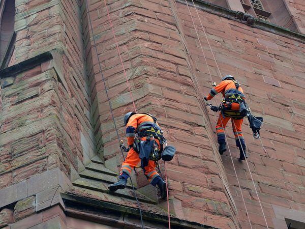 Workmen using abseil ropes to repair St Leonard's in Bridgnorth on Tuesday (Picture by Eddie Brown)