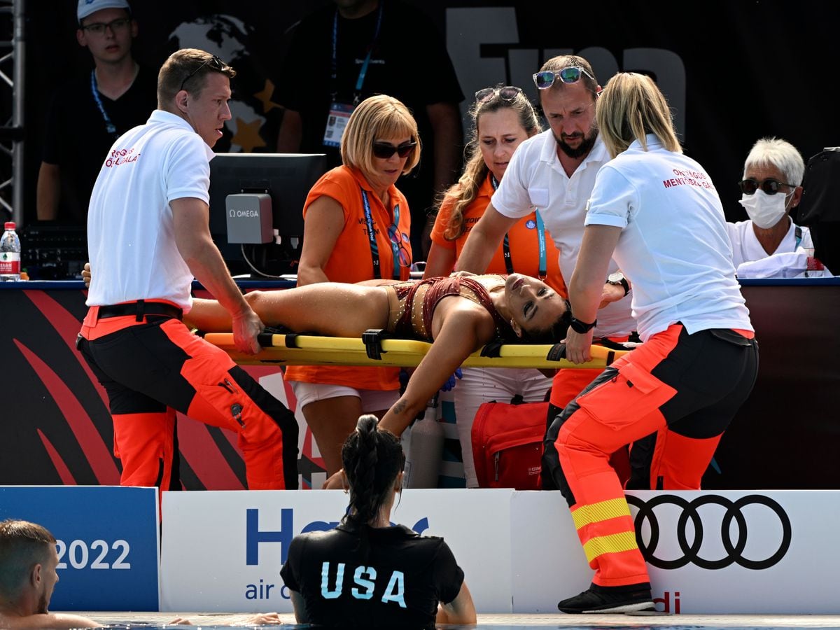 Anita Alvarez is carried on a stretcher after collapsing in Budapest