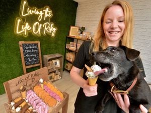 Sarah Meredith and her dog Riley getting ready for the opening of their pop-up shop.