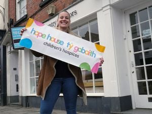 Ludlow's Hope House shop manager Emma Gibson outside the new premises on the Market Square