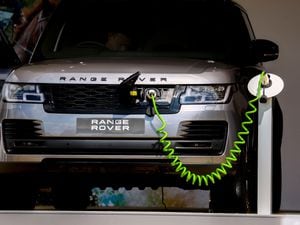 An electric Range Rover made by Jaguar Land Rover being charged