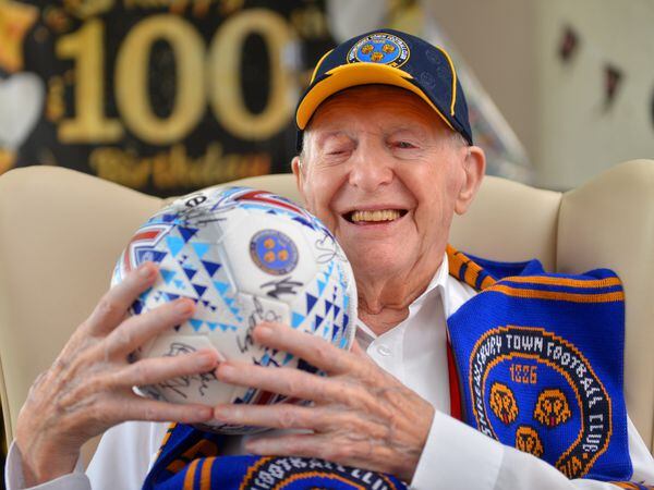 Lawrence with his signed Shrewsbury Town football