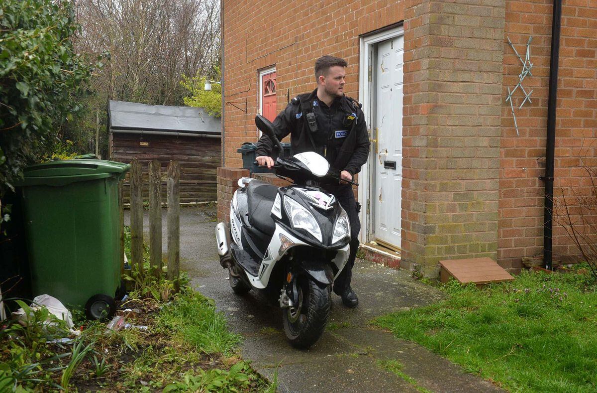 Police seize a bike from a property