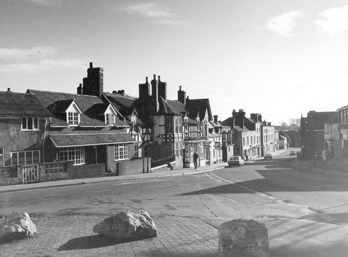 Worth a prize, do you think? This view of Broseley High Street dates from 40 years ago, February 1982. It was emailed in by Paul France who says: "This is one of three mounted photos rescued from a charity shop. They were taken by a D H Rixom and on the back of this one is written 'Street Scape Class, Shot Feb. '82. I think it was probably submitted as a camera club competition entry." Back then it was easier to park, you'll notice.