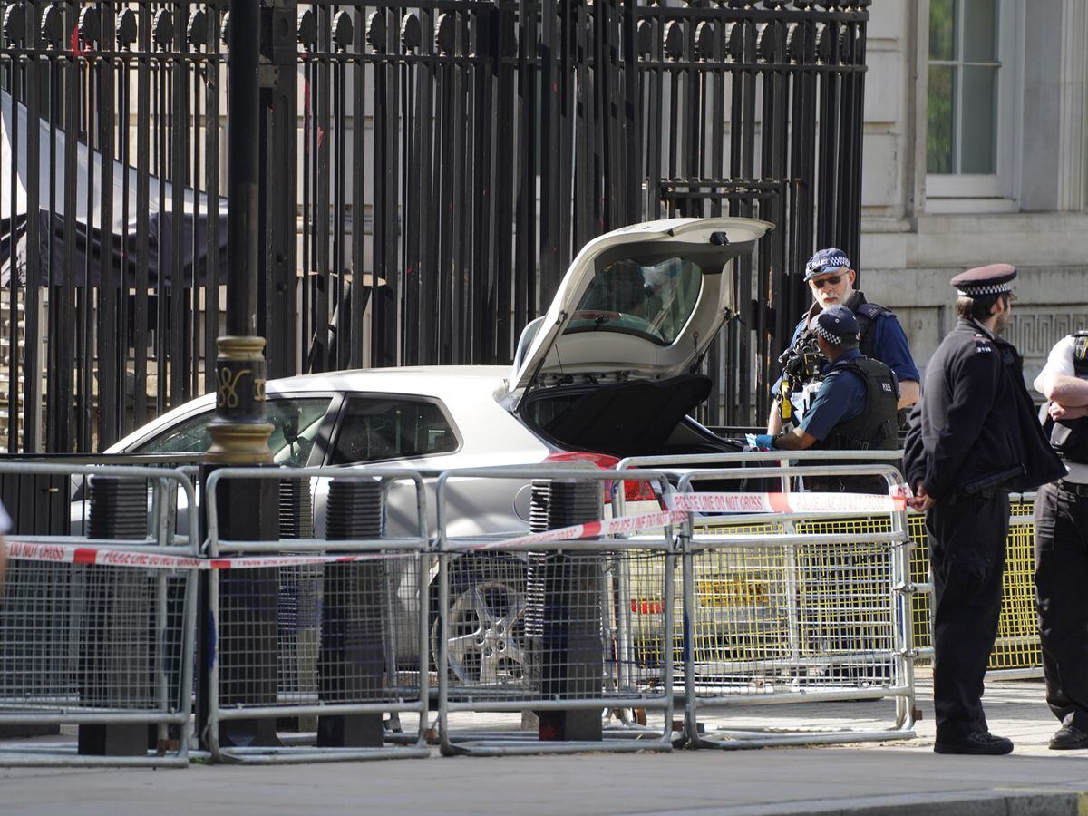 Car at gates of Downing Street