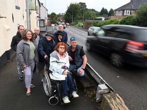 Finger Road where Harp Lane crosses it. Local residents are concerned over speeding and traffic levels which have an effect on the crossing safety. Pictured are Collette Norry in the wheelchair and with her: Chad Davies, Stephen Norry, Graham Norry, Henry Crookshank from The White Horse Pub, Angela Lewis, Rob Wright, Kate Jones..