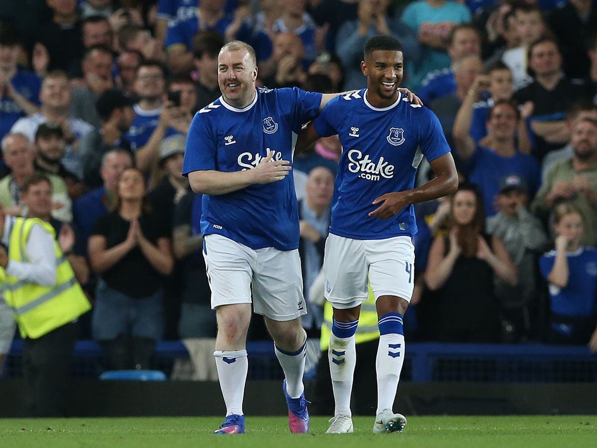 Paul Stratton, left, celebrates with Mason Holgate after being given the chance to score a penalty for Everton