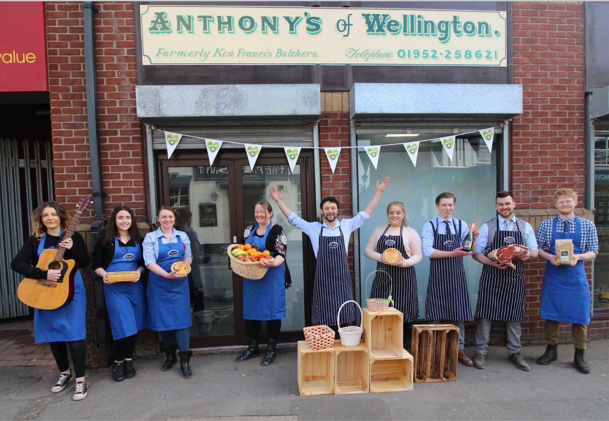 Anthony Nicholls and his team outside his new shop in Wellington