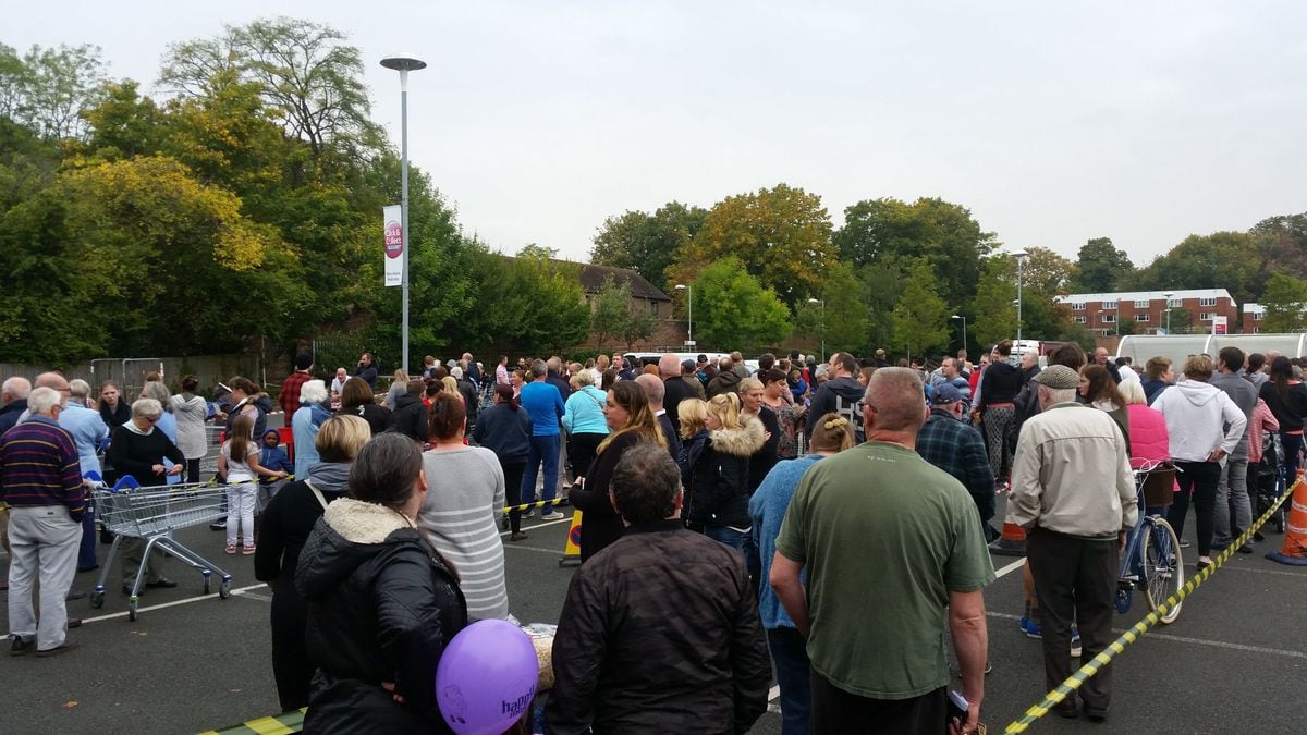 Crowds at Tesco car park in Madeley, where bottled water is being given out. Photo: Andy Silman