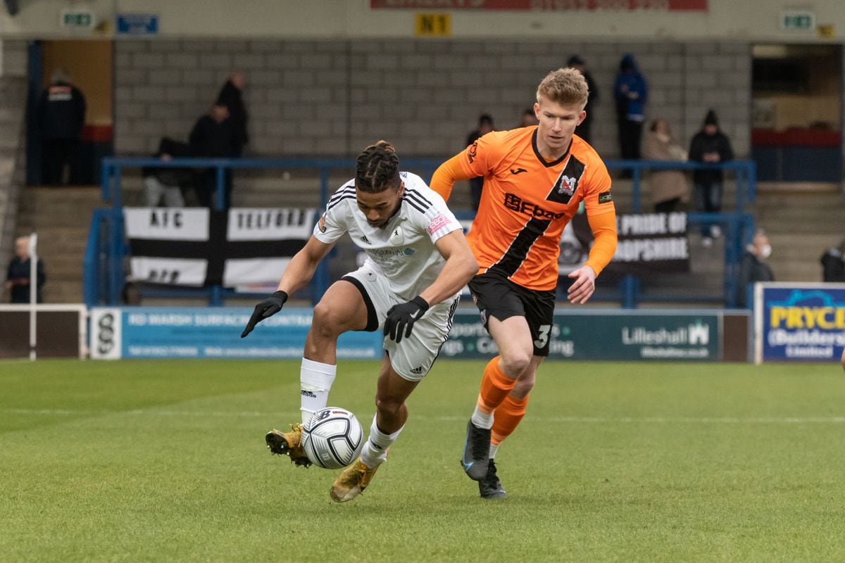 Kai Williams (AFC Telford United Striker) being chased by Darlington player.